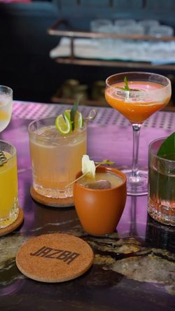 Assorted cocktails served on a bar counter at Jazba, an Indian restaurant with a cocktail bar in East Village.