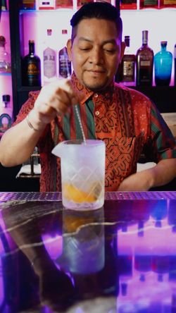 Bartender preparing a cocktail at Jazba, an Indian cuisine restaurant and cocktail bar in East Village.